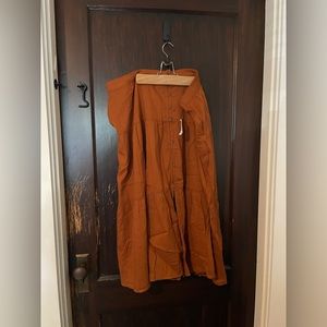 New/ never worn Rust Colored Boho Skirt with buttons, front slit and pockets.